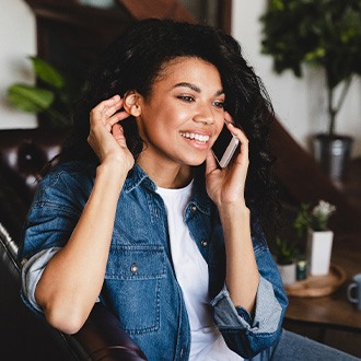 Woman smiling while talking on phone