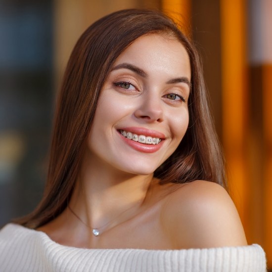 Young woman smiling with adult braces in Wayland