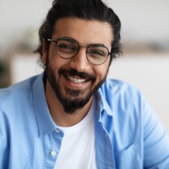 Young man with braces smiling