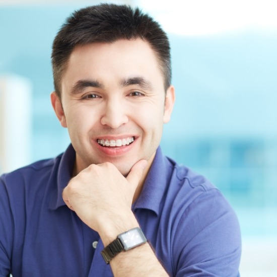 Young man smiling with barely noticeable clear braces in Wayland