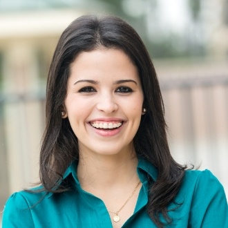 Young woman smiling with clear braces