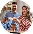 Family of three talking to orthodontic office receptionist at front desk