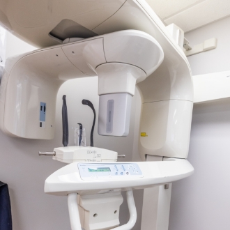 Orthodontic scanner device standing against white wall