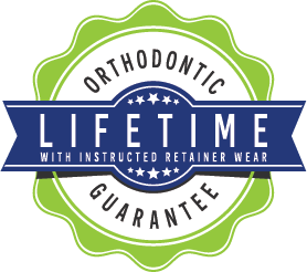 Badge that reads orthodontic lifetime guarantee with instructed retainer wear