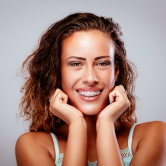 Smiling woman with adult orthodontics