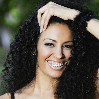 Smiling adult woman with braces