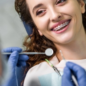 Young woman with braces at an orthodontic checkup